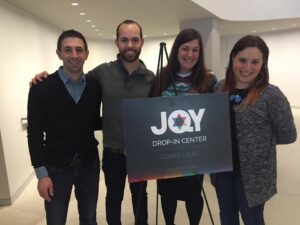 Staff and members gather and hold a meeting at JQY, a safe haven for queer Orthodox Jews. 